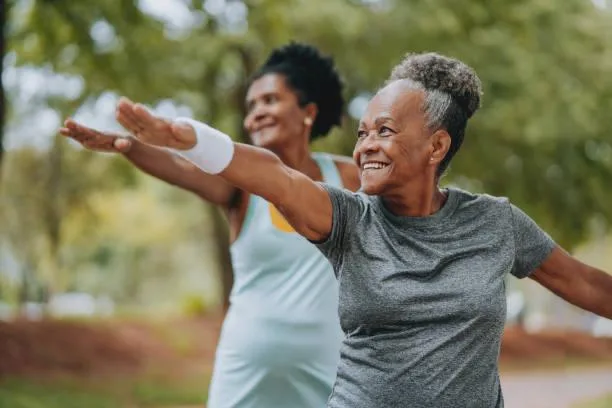 Two women enjoying outdoor exercise at Harmony House